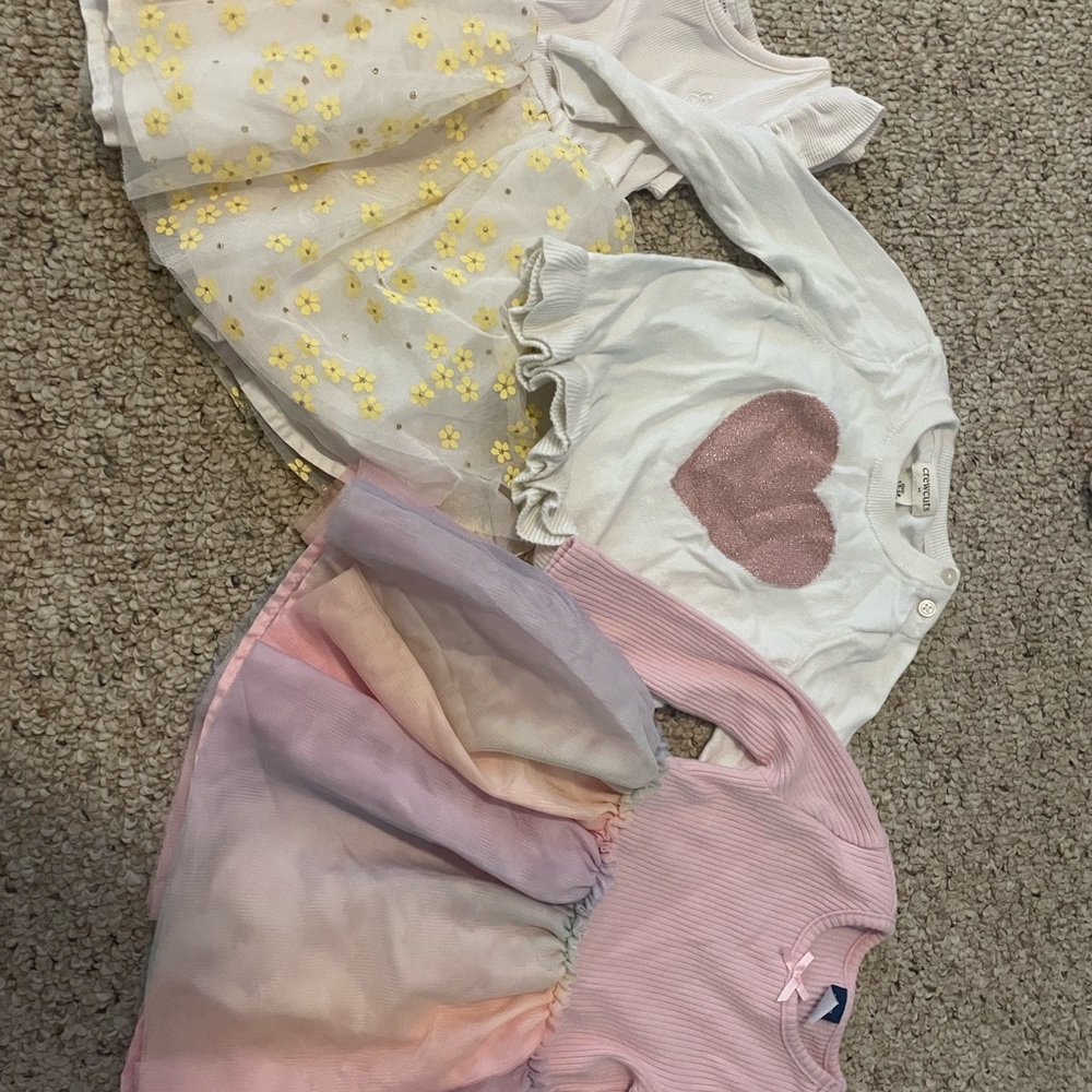 2 dresses and a sweater